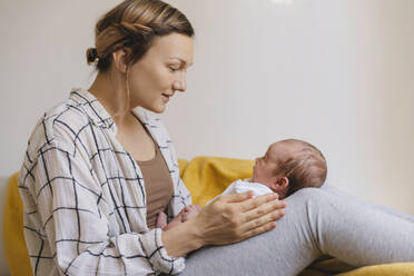 Loving mother spending time with cute baby boy at home - NDEF01481