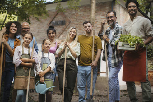 People working in community garden at socially inclusive neighbourhood project - HAPF03671