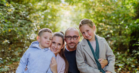 Portrait of happy family with kids in forest. - HPIF32727