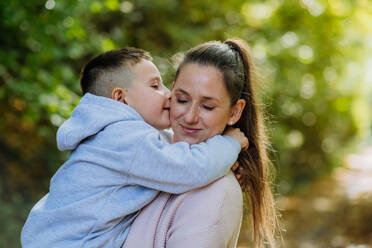 Portrait of mother with her son in a forest. - HPIF32731