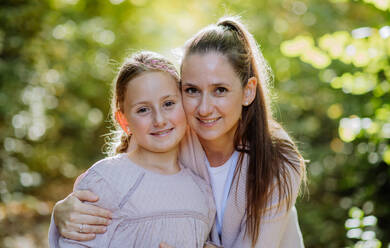 Portrait of mother with her daughter in a forest. - HPIF32732