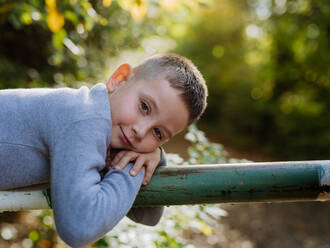 Portrait of happy boy in a forest. - HPIF32743