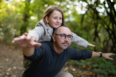 Father with his little daughter having fun in a forest. - HPIF32744