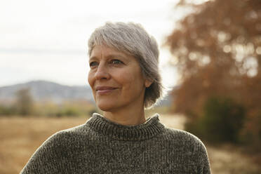 Smiling mature woman wearing sweater - EBSF04194
