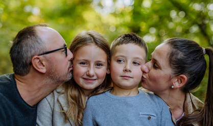 Portrait of happy family with kids in forest. - HPIF32787