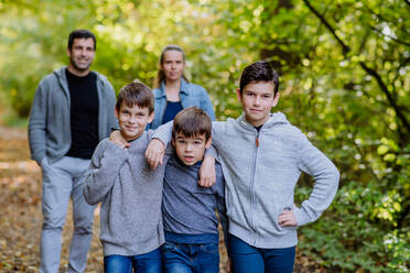 Portrait of happy family with kids in forest. - HPIF32789