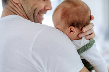 Close-up of father holding his little new born baby. - HPIF32989