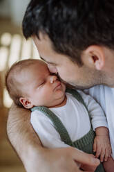 Close-up of father kissing his little new born baby. - HPIF33019