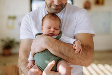 Close-up of father holding his little new born baby. - HPIF33025