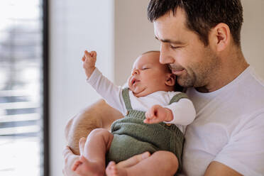 Close-up of father holding his little new born baby. - HPIF33028