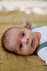 Portrait of a baby lying in a bed. - HPIF33044