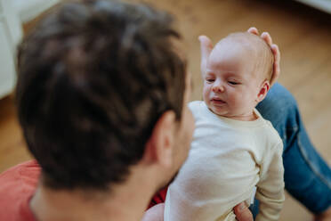 Close-up of father holding his little new born baby. - HPIF33088