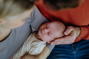 Close-up of parents cuddling their newborn son. - HPIF33094