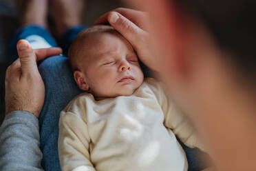 Close-up of father cuddling his little new born baby. - HPIF33101