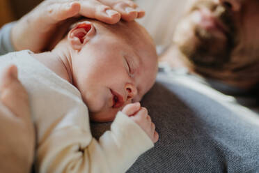 Close-up of father cuddling his little new born baby. - HPIF33106