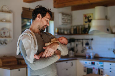 Close-up of father holding his little new born baby. - HPIF33118