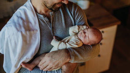 Close-up of father holding his little new born baby. - HPIF33120