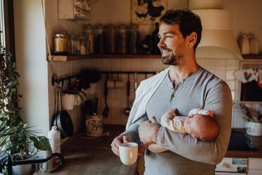 Close-up of father holding his little new born baby. - HPIF33123