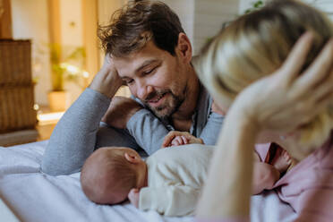 Close-up of parents cuddling their newborn son. - HPIF33135
