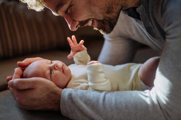 Close-up of father cuddling his little new born baby. - HPIF33157