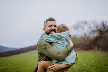 Father and his little son on a walk in the nature. - HPIF33289