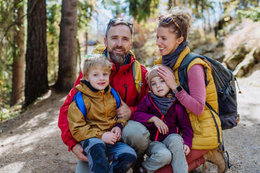 Happy young family with little children, resting near a lake in mountains. - HPIF33564