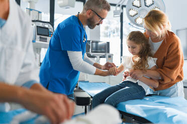 Little girl with mother in surgery examination. - HPIF33718