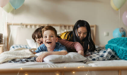 Three happy friends having fun together in room. - HPIF33934