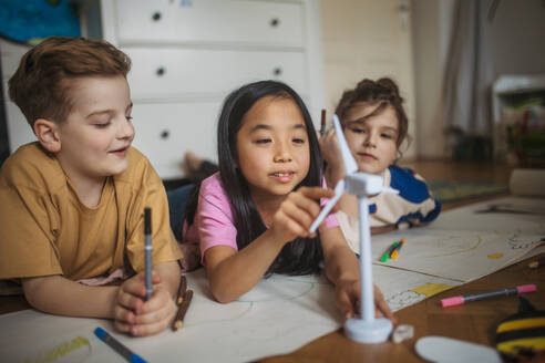 Happy friends drawing together in the room. - HPIF33981