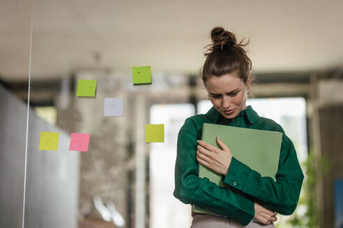 Young sad woman in office, having troubles. - HPIF34066