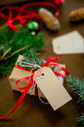 Christmas background concept. top view of christmas gift box red balls with spruce branches, pine cones, red berries on old wooden background. New Year concept - ADSF50128