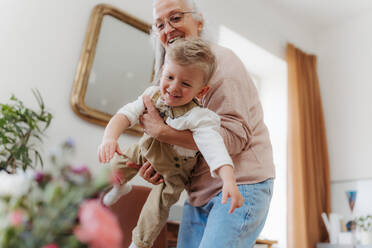 Senior woman having fun with little grandson. - HPIF35001