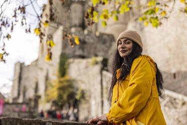 Beautiful woman wearing knit hat in front of Saint Michel castle - JCCMF10989