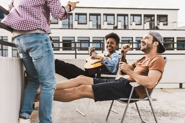 Smiling friends having party on terrace - UUF30747