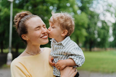 Young mother with little son on a walk after walk. - HPIF35382