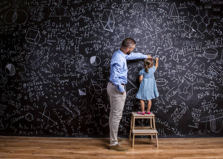 Studio shot of children and teacher, school time. - HPIF35549