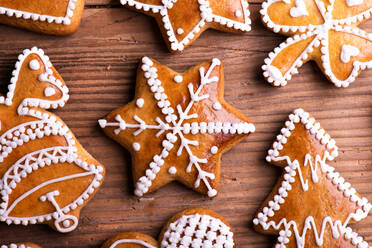 Christmas composition with gingerbreads. Studio shot on wooden background. - HPIF35689