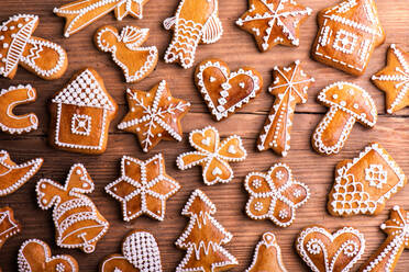Christmas composition with gingerbreads. Studio shot on wooden background. - HPIF35691