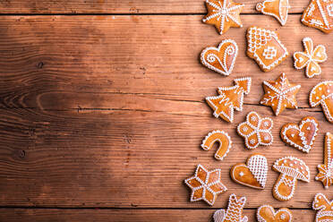 Christmas composition with gingerbreads. Studio shot on wooden background. - HPIF35696