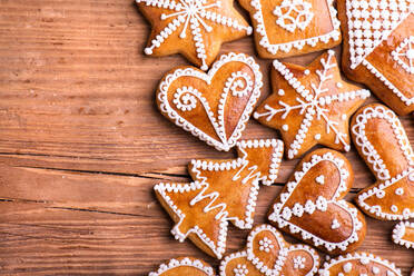 Christmas composition with gingerbreads. Studio shot on wooden background. - HPIF35697