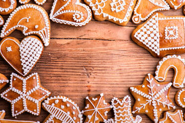 Christmas composition with gingerbreads. Studio shot on wooden background. - HPIF35704