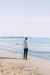 Man standing near sea at beach - EGHF00821