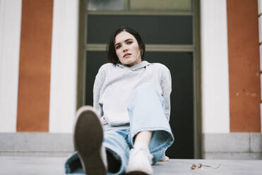 Young woman posing in front of building - SVCF00451