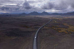 Iceland, Austurland, Aerial view of lone truck driving along Route 1 - RUEF04275