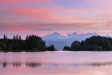 Germany, Bavaria, Illasbergsee and Forggensee lakes at moody dusk - RUEF04277