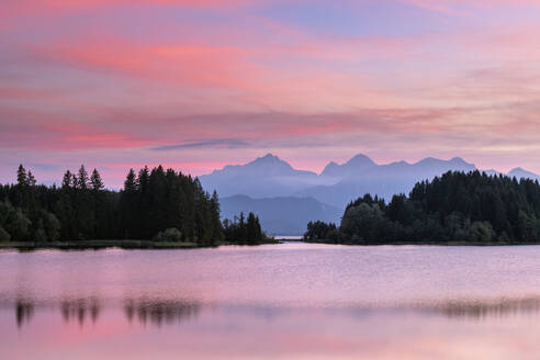 Germany, Bavaria, Illasbergsee and Forggensee lakes at moody dusk - RUEF04277