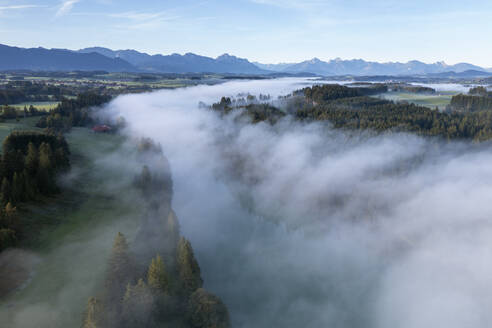 Germany, Bavaria, Aerial view of thick fog over river Lech in autumn - RUEF04280