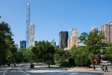 New York City cityscape viewed from the West Drive, the westernmost of Central Park's scenic drives, nestled between Upper West Side and Upper East Side neighborhoods of Manhattan, New York City, United States of America, North America - RHPLF30316