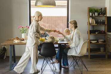 Family having lunch together at dining table - SEAF02149