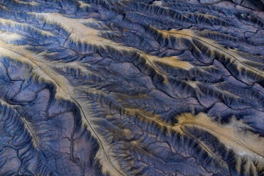 This image captures the intricate details of a winding rugged mountain terrain from an aerial perspective. - ADSF50645